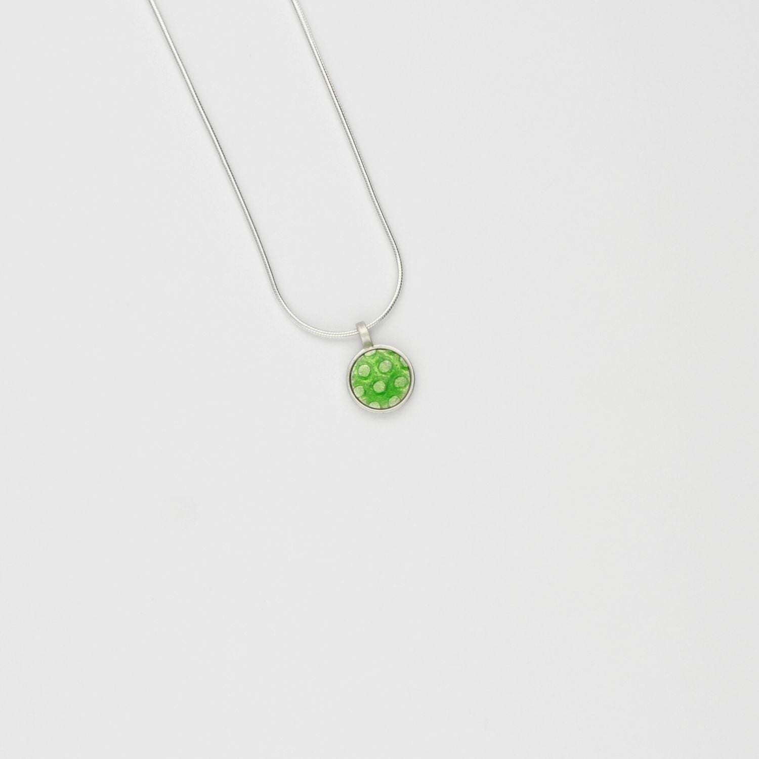 Small green spot silver pendant by Kathryn Willis