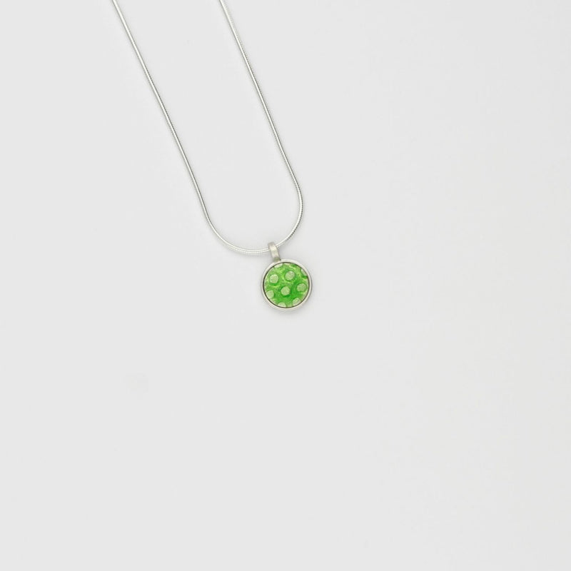 Small green spot silver pendant by Kathryn Willis