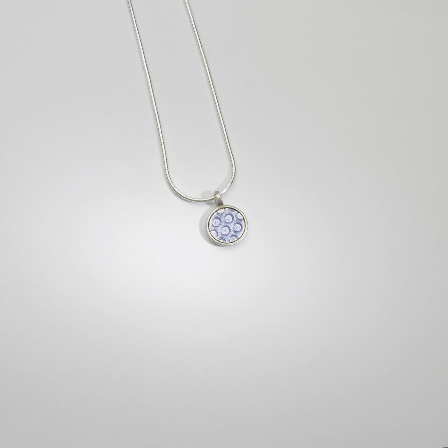 Small lilac spot silver pendant by Kathryn Willis