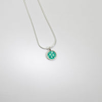 Small turquoise spot silver pendant by Kathryn Willis