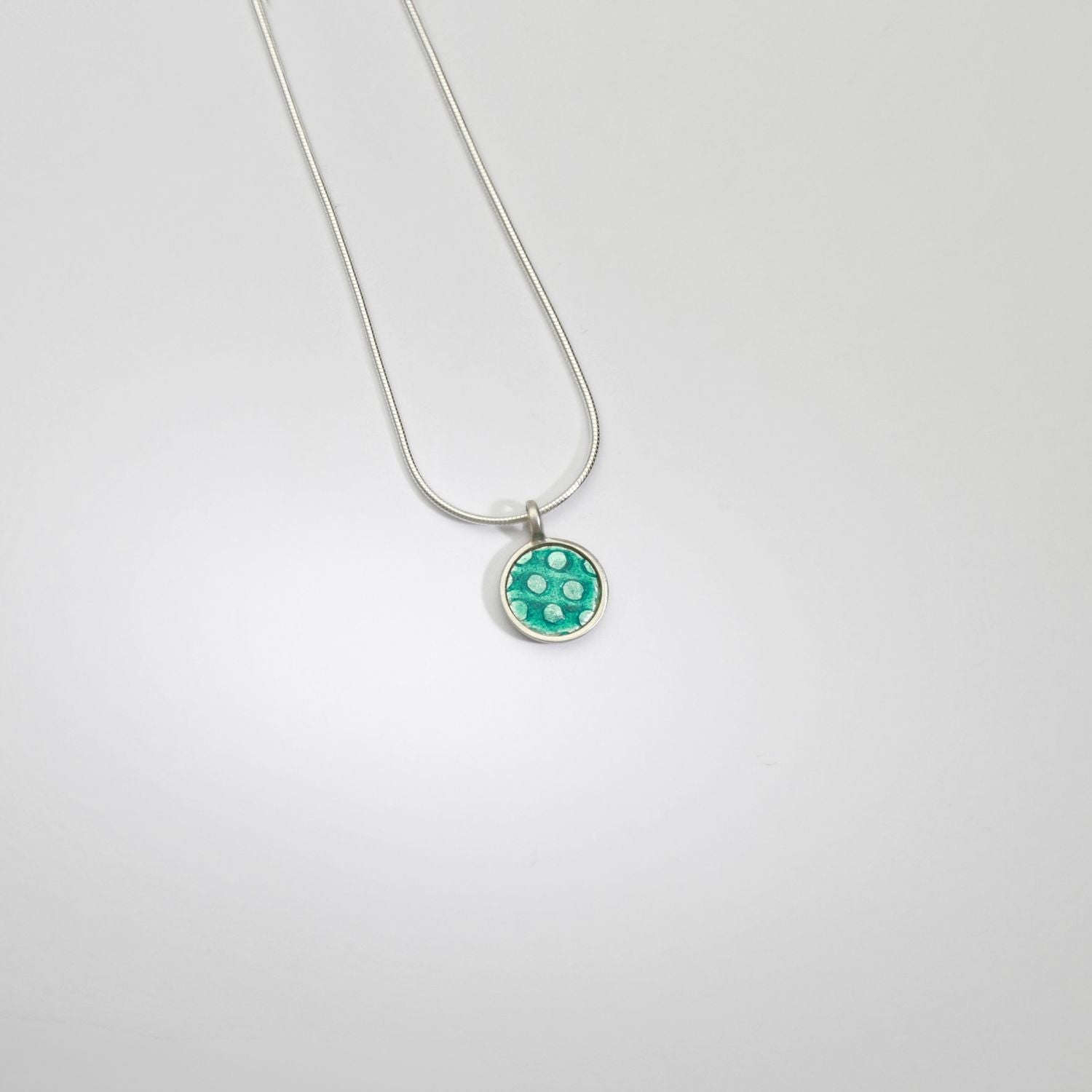 Small turquoise spot silver pendant by Kathryn Willis