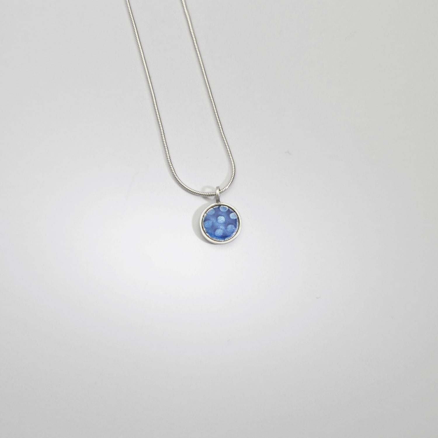 Small blue/purple spot silver pendant by Kathryn Willis