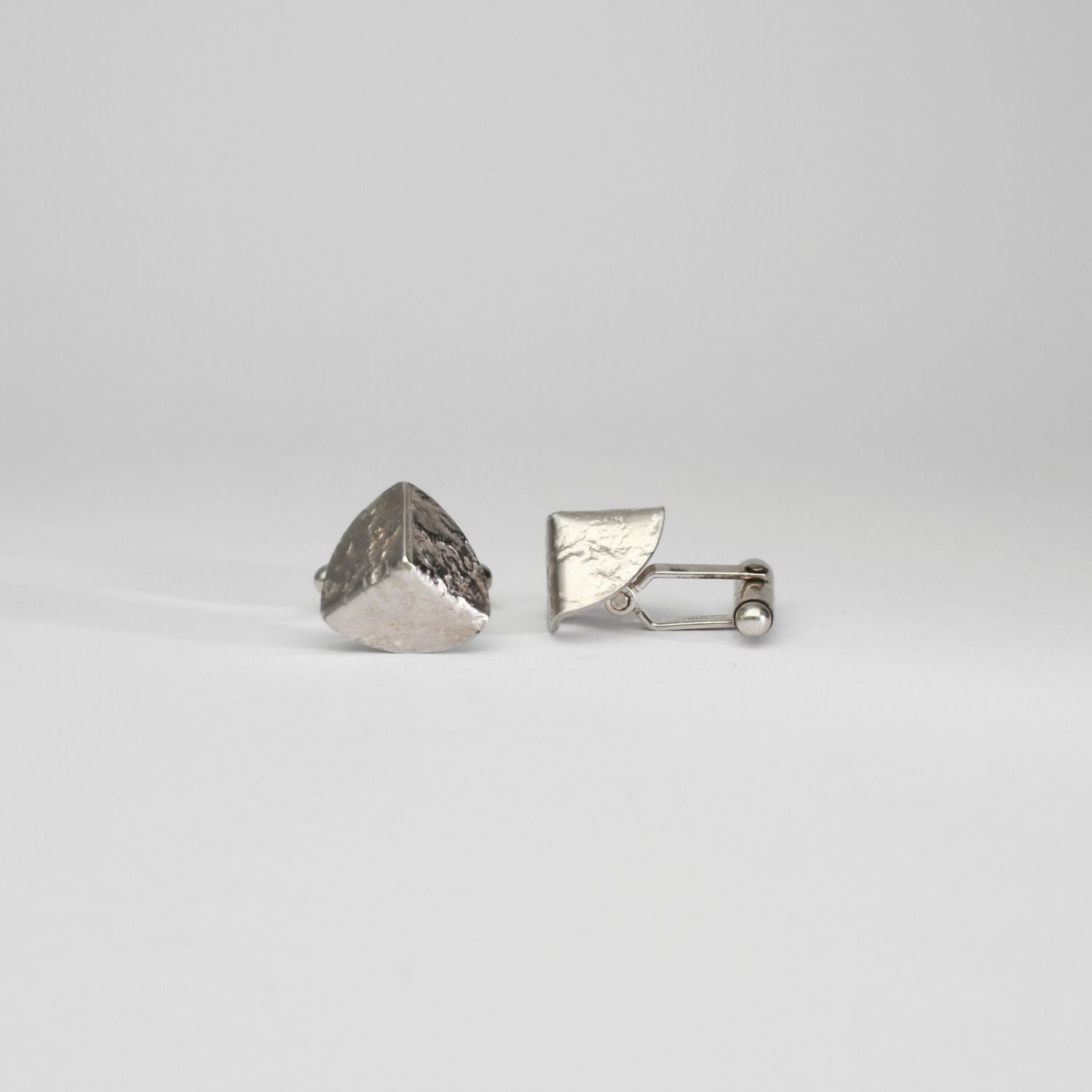 Tricornel decay silver cufflinks by Karen Williams