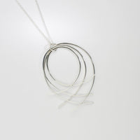 Filament netted large silver pendant by Karen Williams