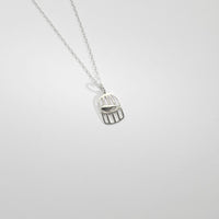 Mini silver birdcage pendant by Kate Wimbush