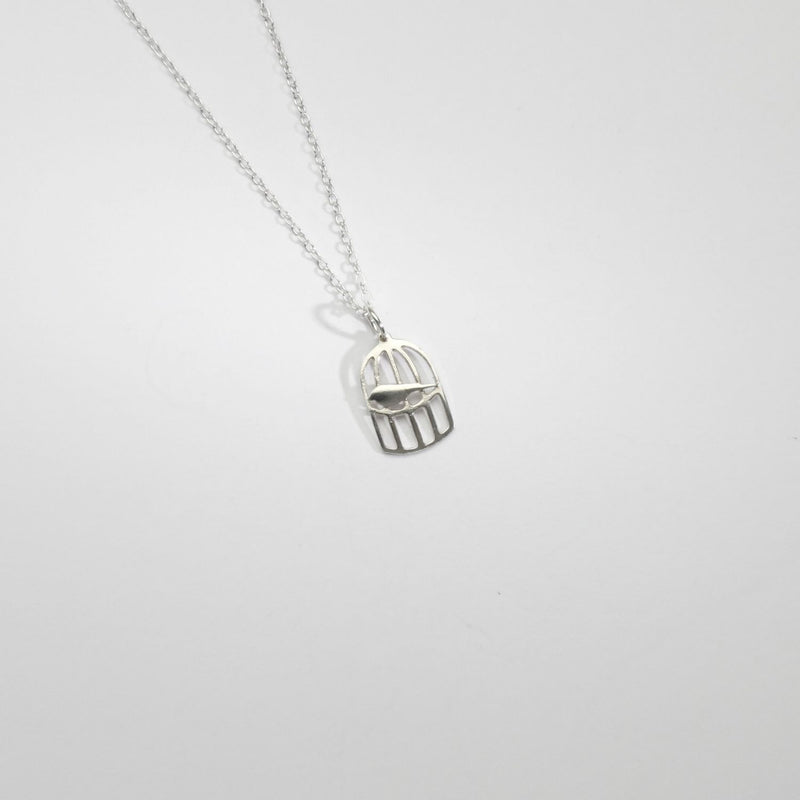 Mini silver birdcage pendant by Kate Wimbush