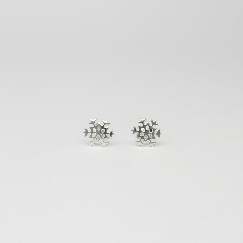 Small snowflake silver studs by Kate Wimbush