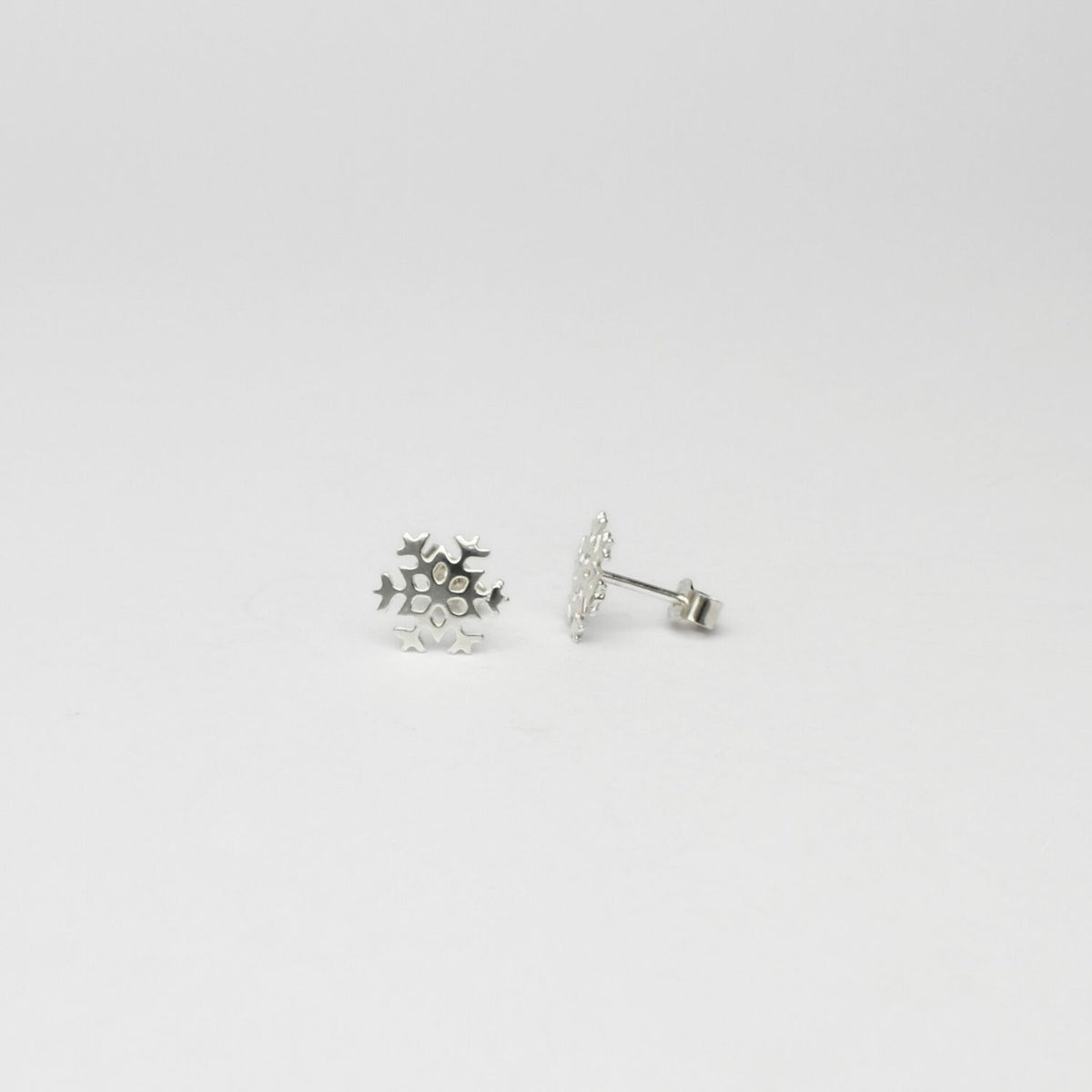 Small snowflake silver studs by Kate Wimbush