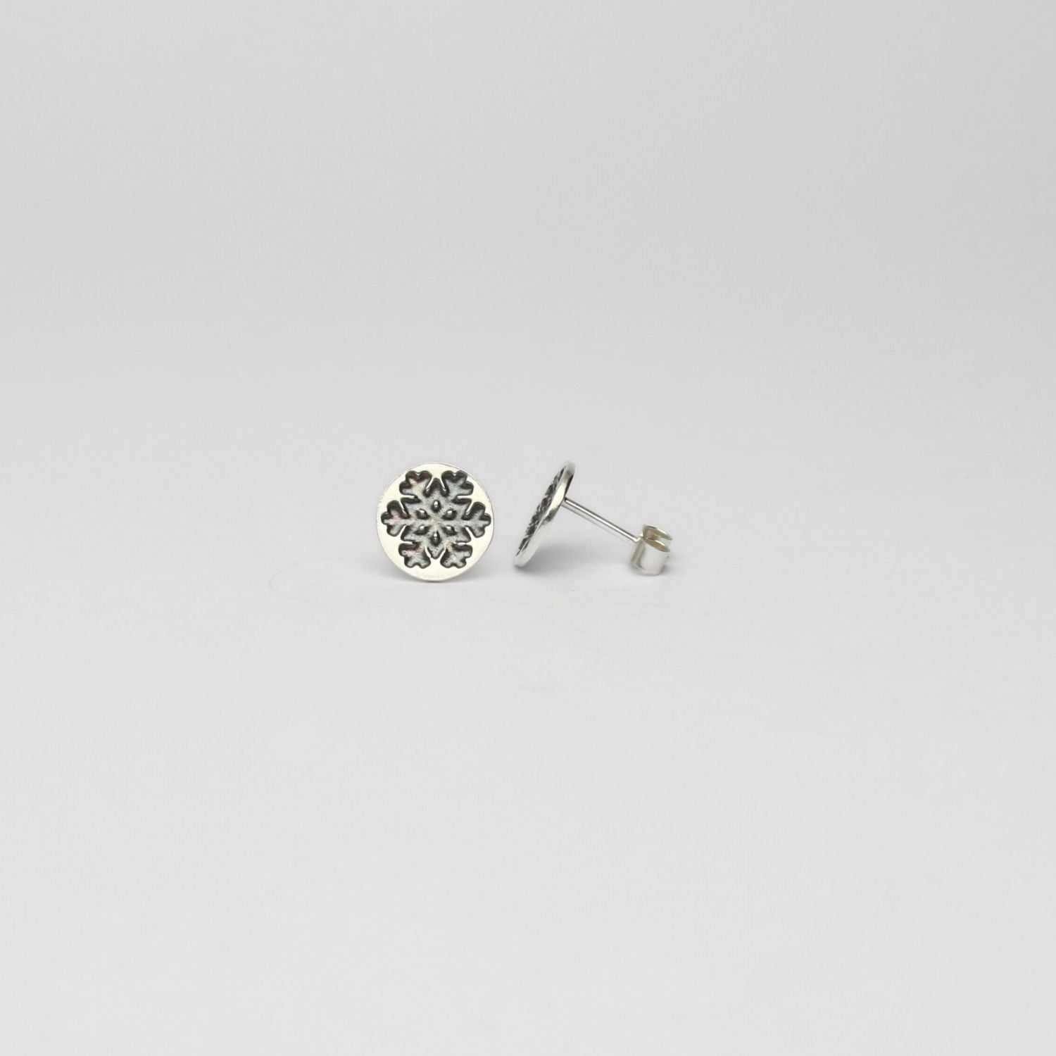 Round snowflake black silver studs by Kate Wimbush