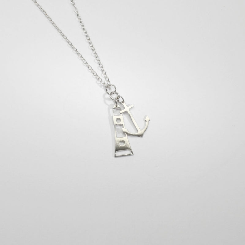 Anchor and lighthouse silver pendant by Kate Wimbush