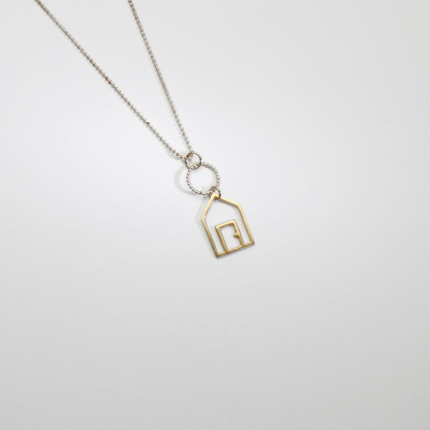Beach hut silver & 9ct gold pendant by Kate Wimbush