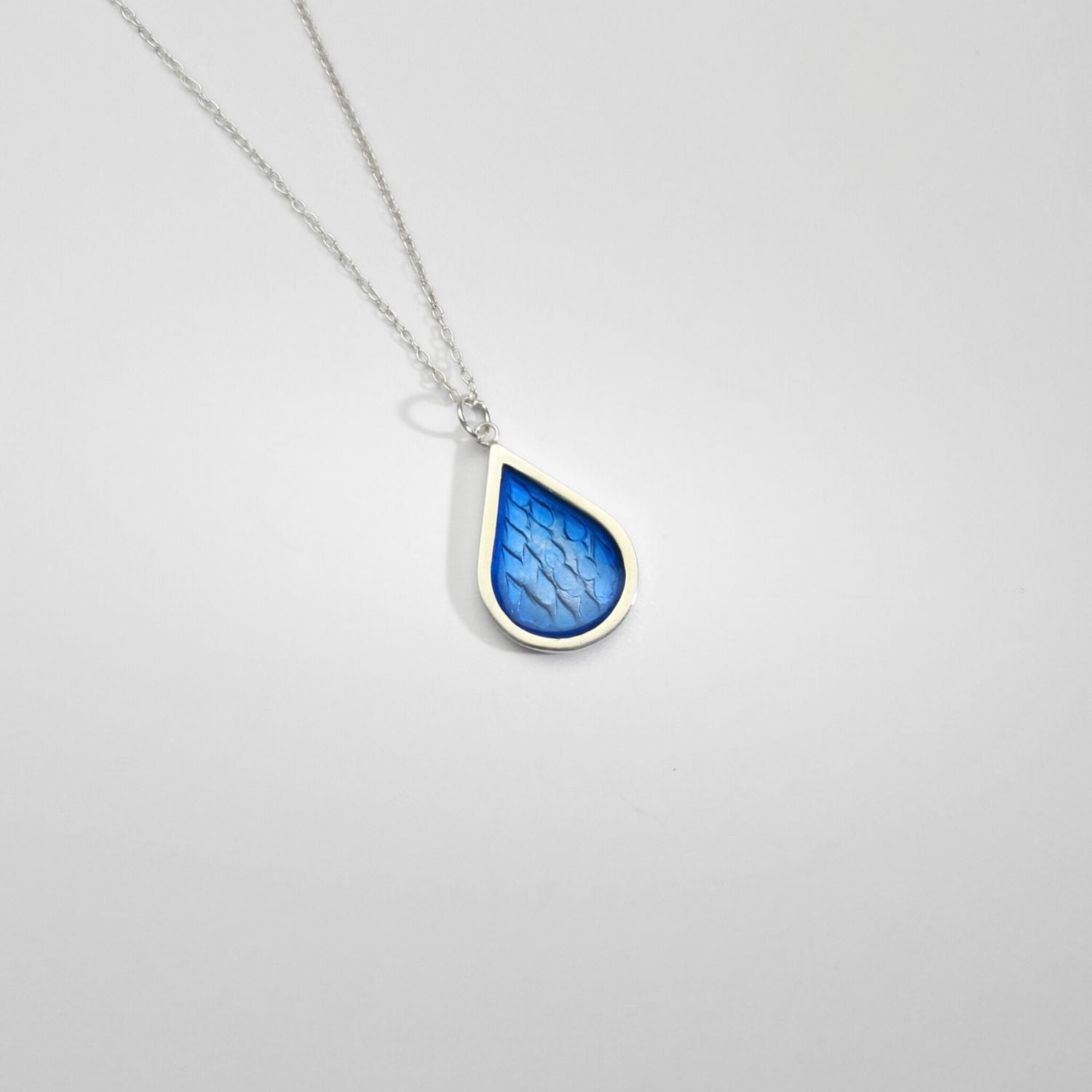 Blue raindrop silver & resin pendant by Kate Wimbush