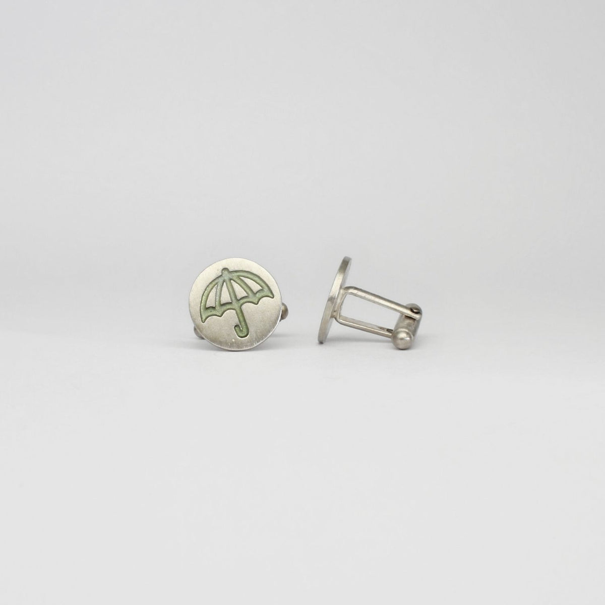 Umbrella silver cufflinks by Kate Wimbush