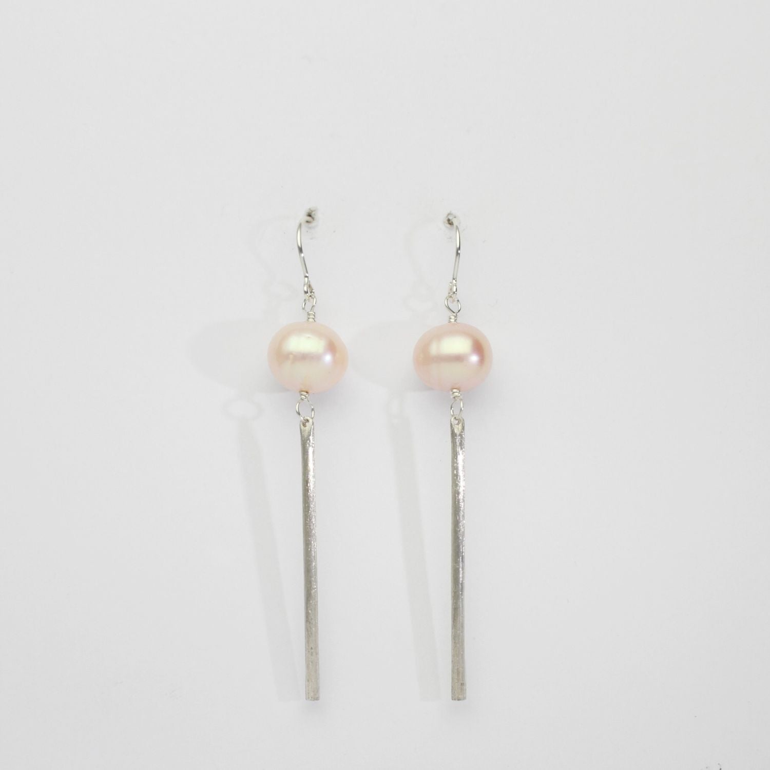 Peach wave pearls & frosted rod silver hook earrings by Natalie Vardey