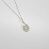 Silver oval lace and white pearl pendant by Natalie Vardey