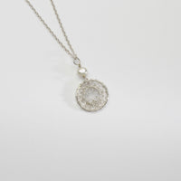 Lace circle with white pearl silver pendant by Natalie Vardey