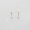 Small white & small white pearl stud earrings by Natalie Vardey