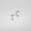 Small white & small white pearl stud earrings by Natalie Vardey