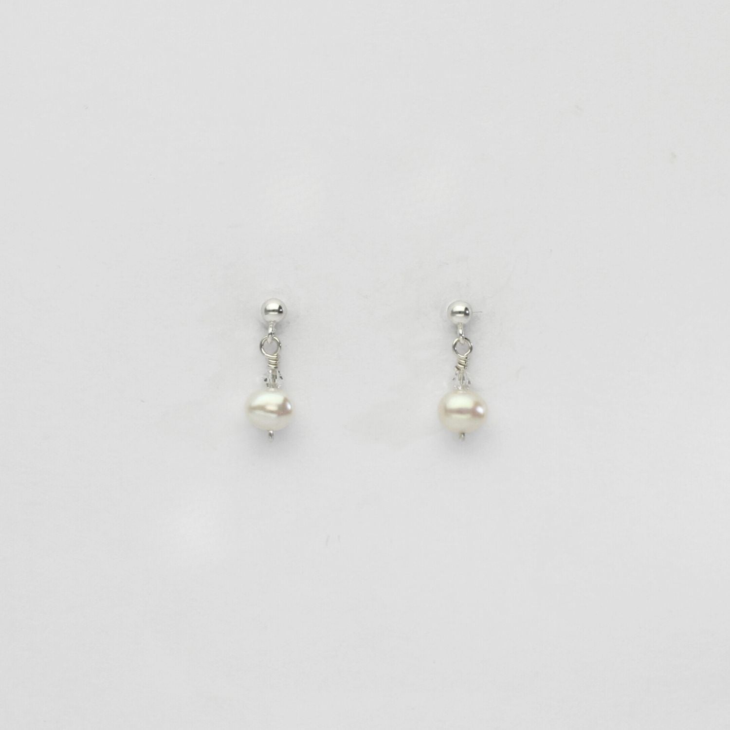 Small white pearl & swarovski stud earrings by Natalie Vardey