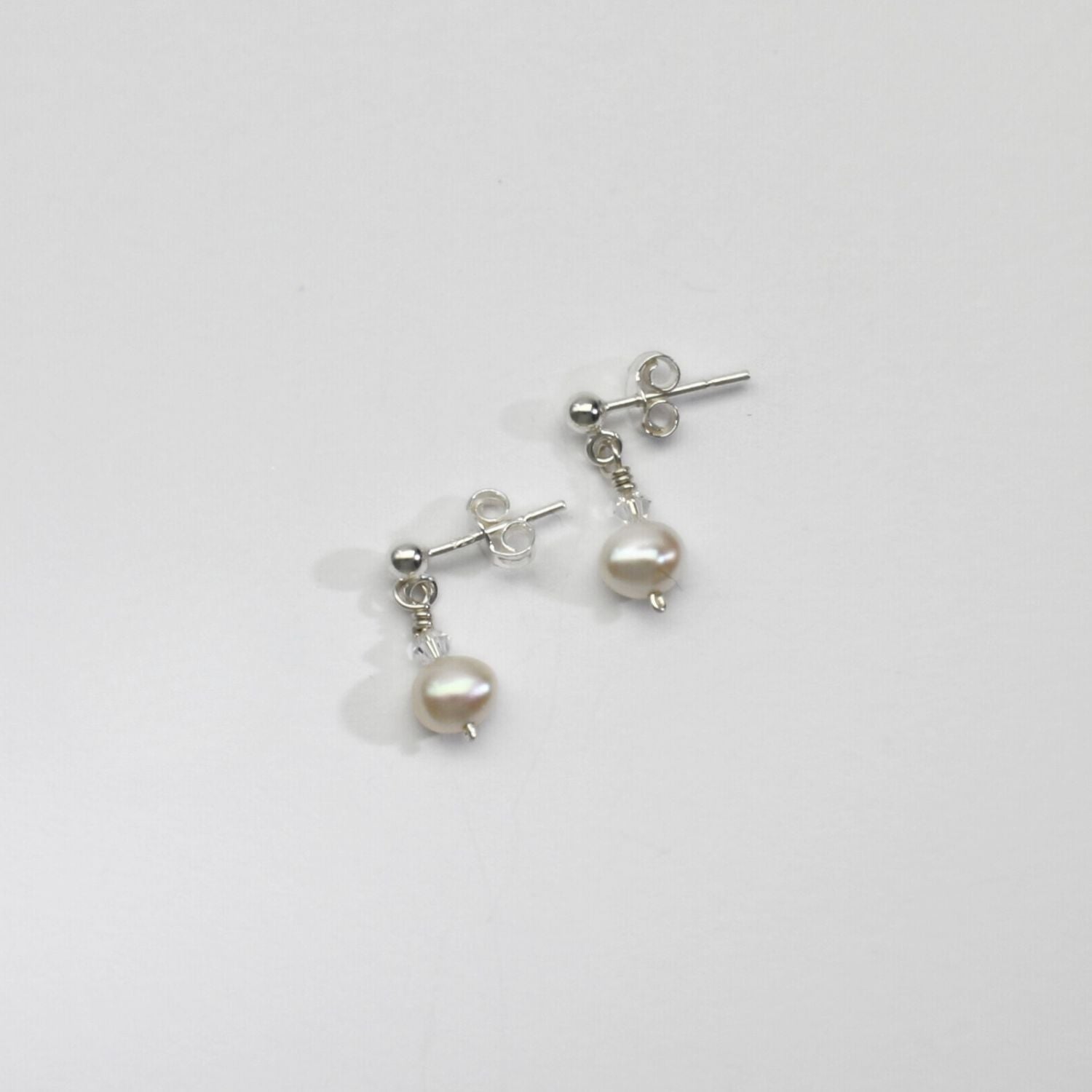Small white pearl & swarovski stud earrings by Natalie Vardey