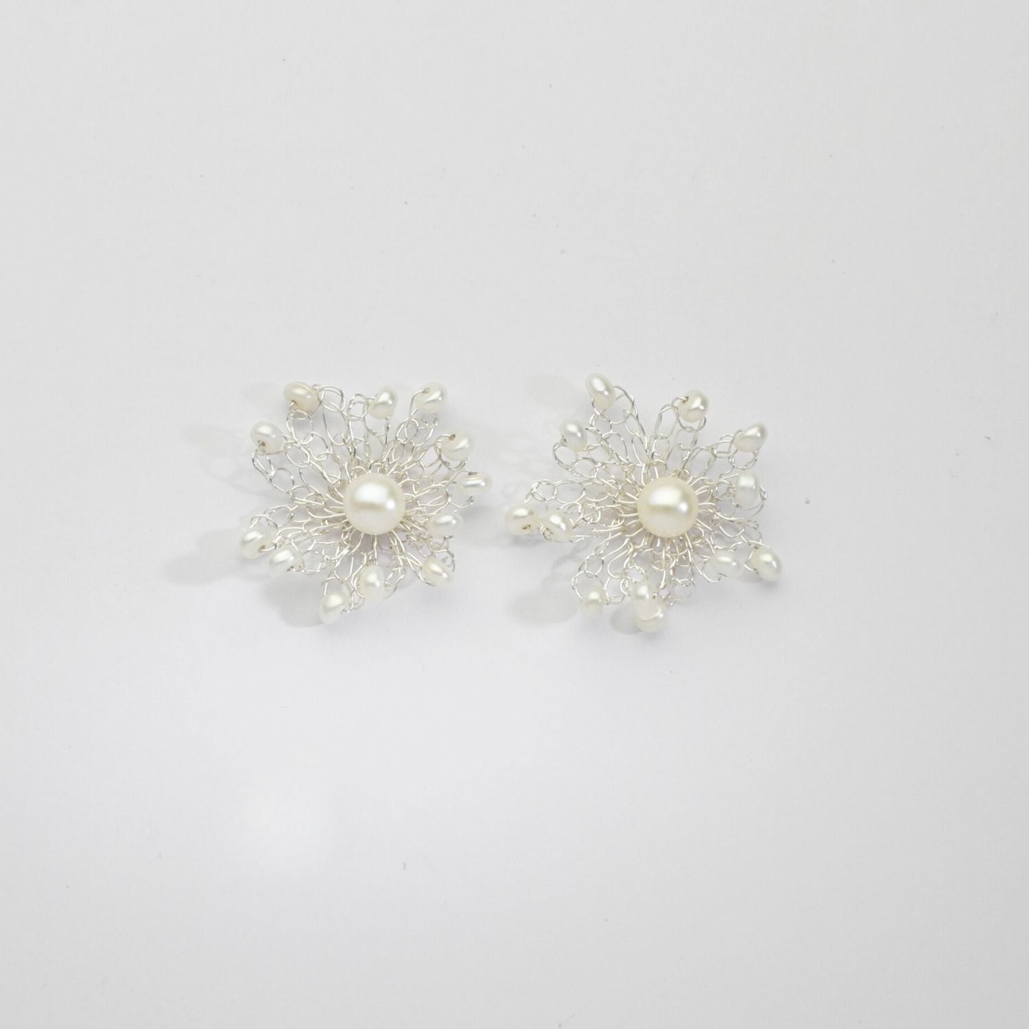 Flower frill white pearl stud earrings by Natalie Vardey