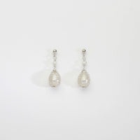 White pearl silver bound stud earrings by Natalie Vardey