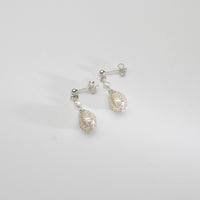 White pearl silver bound stud earrings by Natalie Vardey