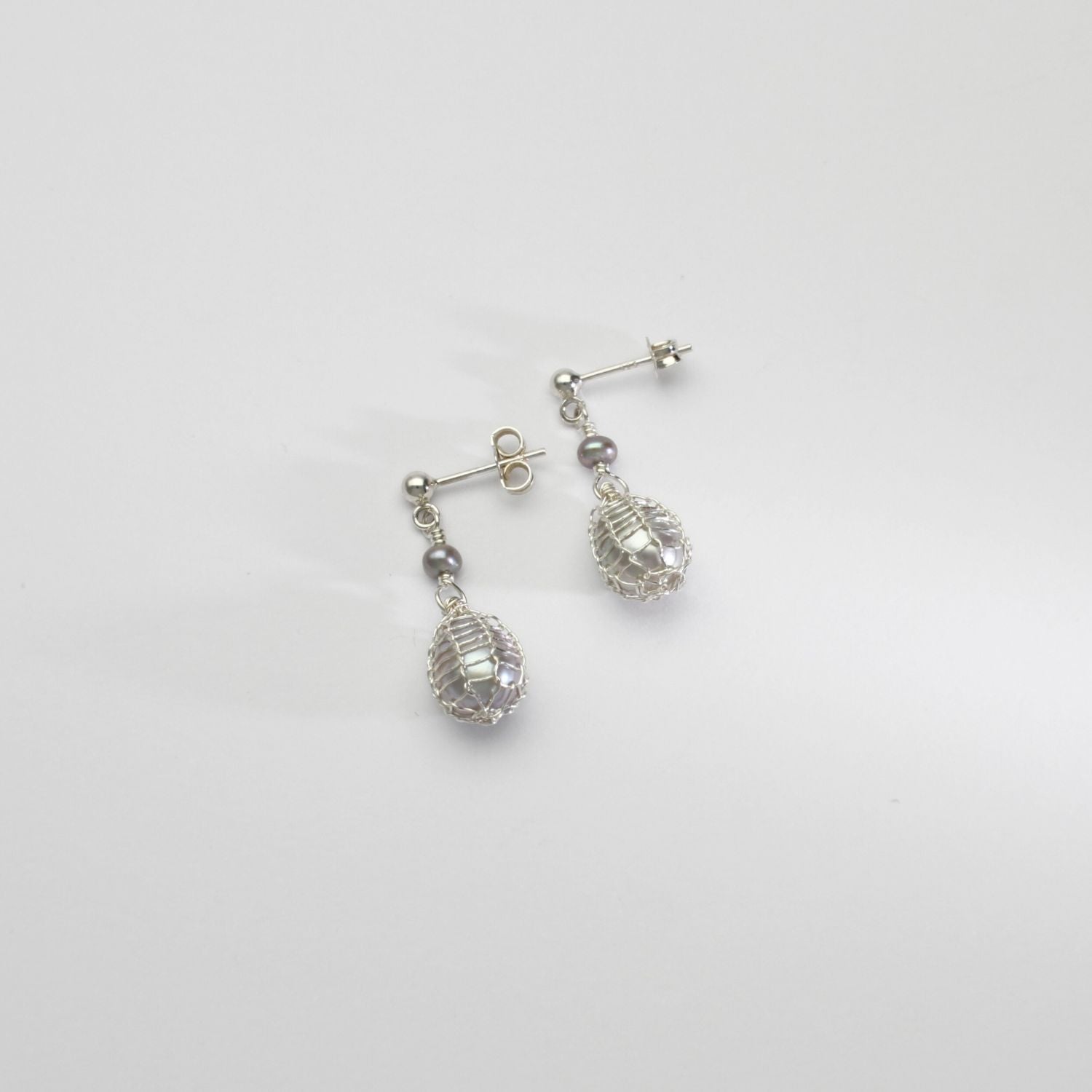 Grey pearl bound silver stud earrings by Natalie Vardey