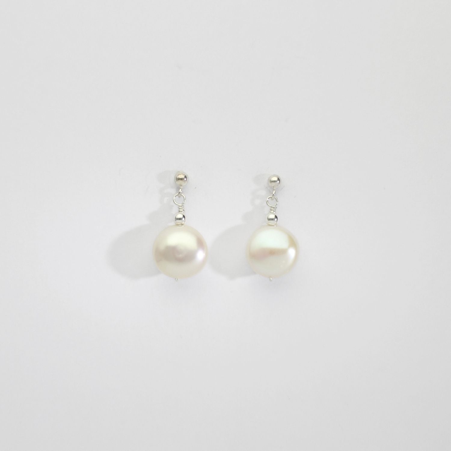 White pearl coin & silver bead stud earrings by Natalie Vardey