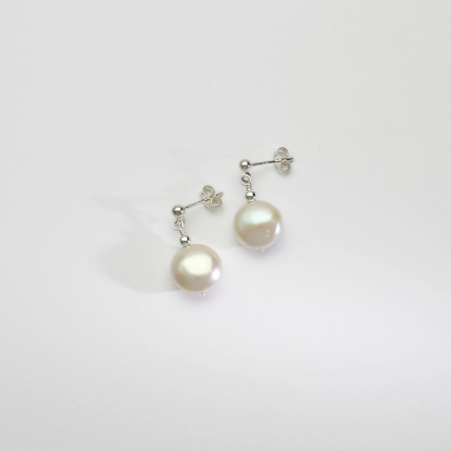 White pearl coin & silver bead stud earrings by Natalie Vardey