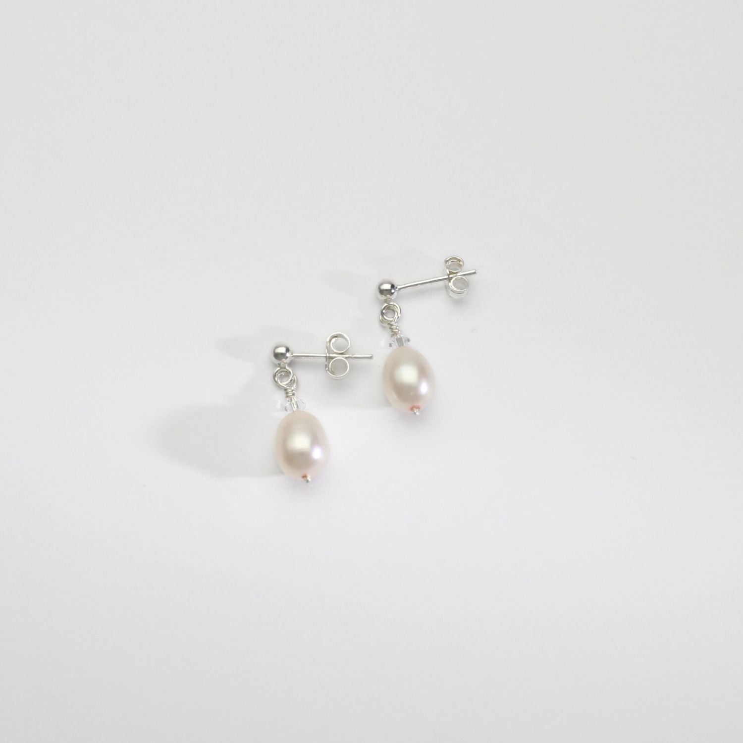 Lustre rice pearls & Swarovski crystal silver stud earrings by Natalie Vardey