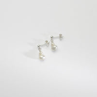 Small white squab & wee white pearl silver stud earrings by Natalie Vardey