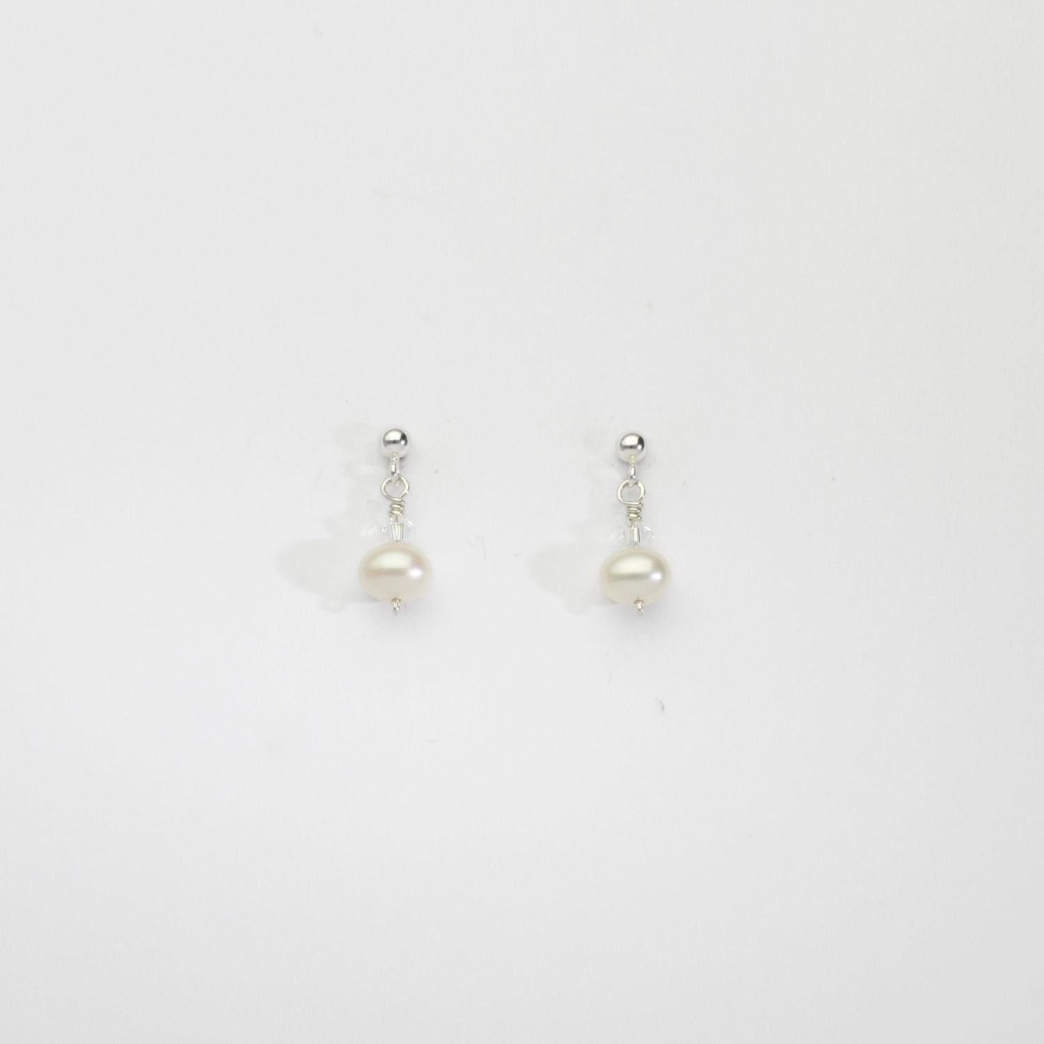 White squab & Swarovski crystal silver stud earrings by Natalie Vardey