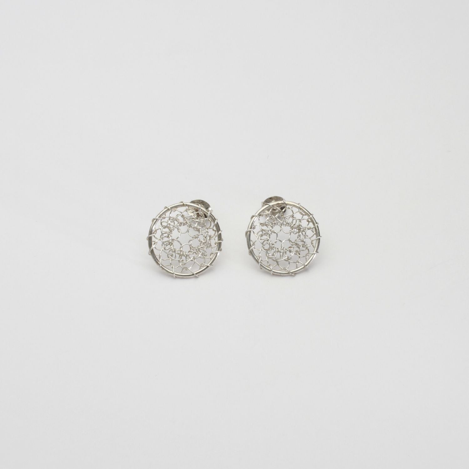 Lace circle silver studs by Natalie Vardey