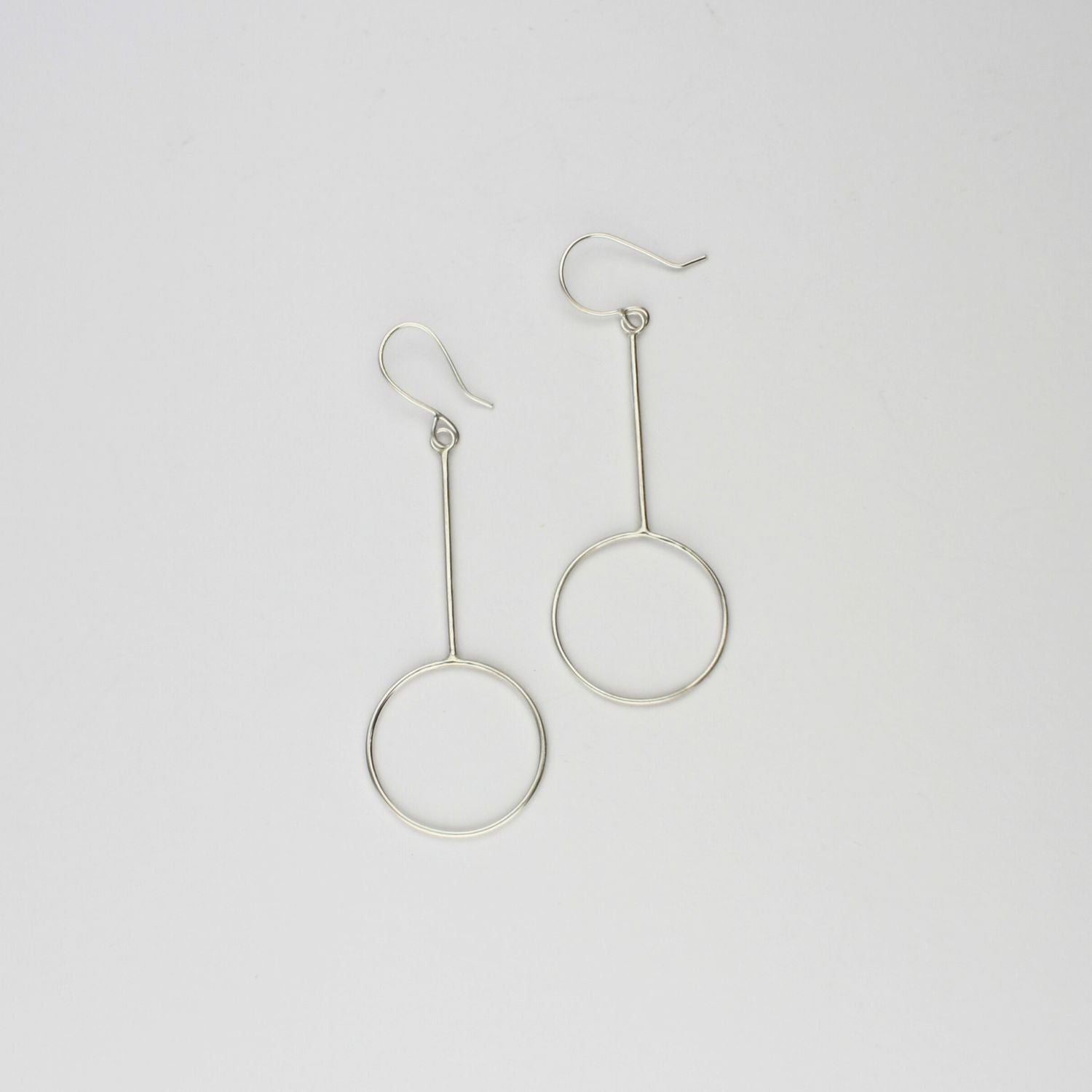 Large circle drop silver earrings by Polished Grey