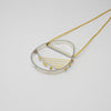 Hepworth silver necklace on yellow silk thread by Polished Grey