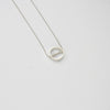 Tiny revolve silver necklace by Polished Grey