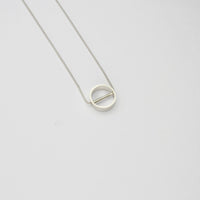 Tiny revolve silver necklace by Polished Grey