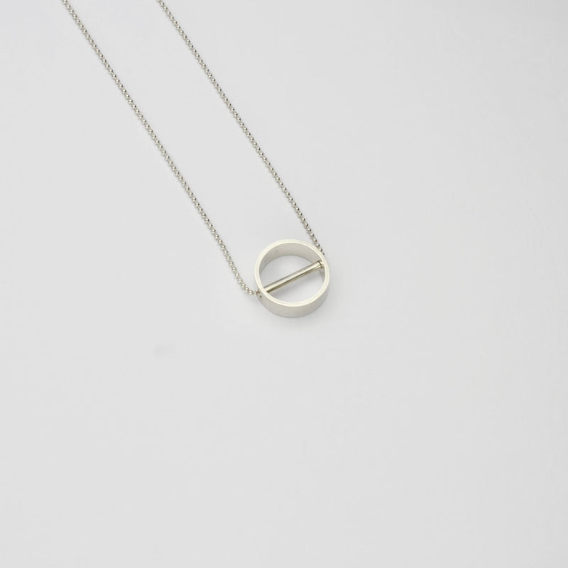Tiny revolve silver necklace by Polished Grey