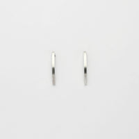 Large silver arc studs by Polished Grey