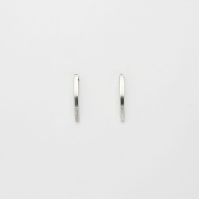 Large silver arc studs by Polished Grey