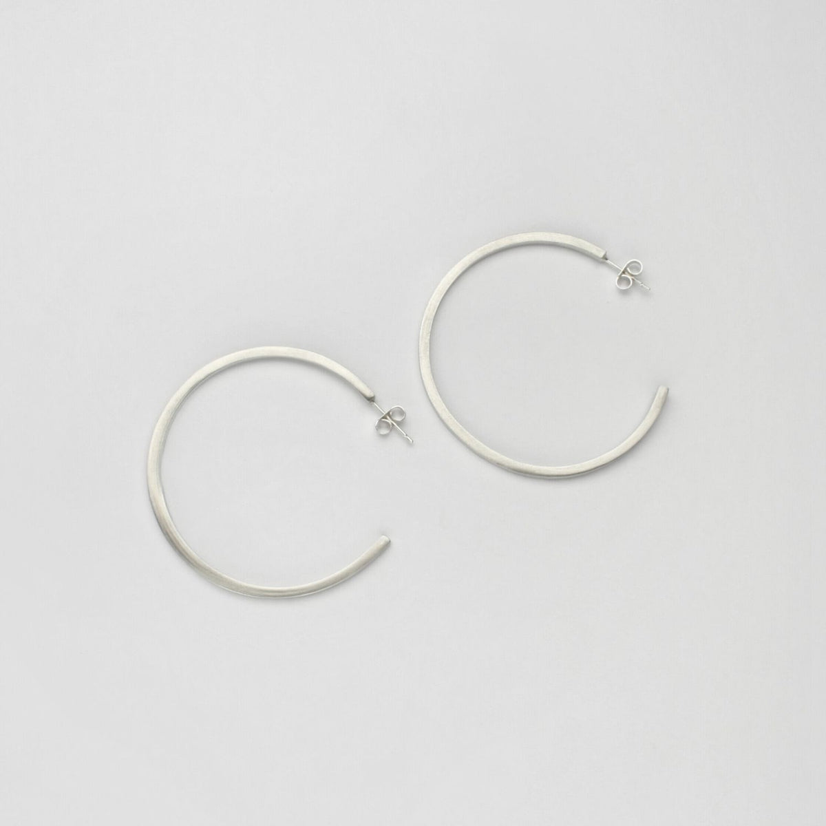 Large silver hoops by Polished Grey