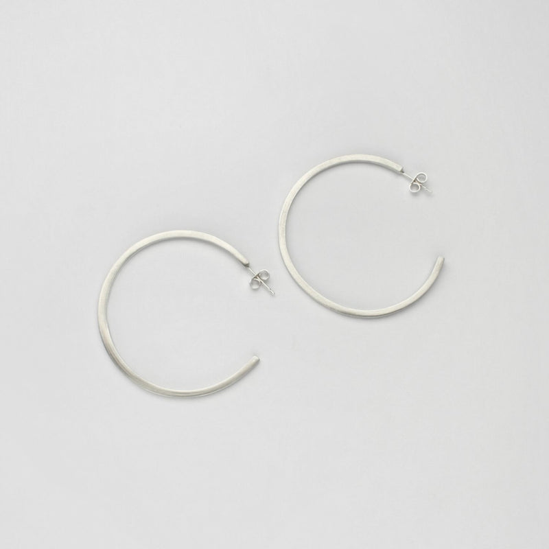 Large silver hoops by Polished Grey
