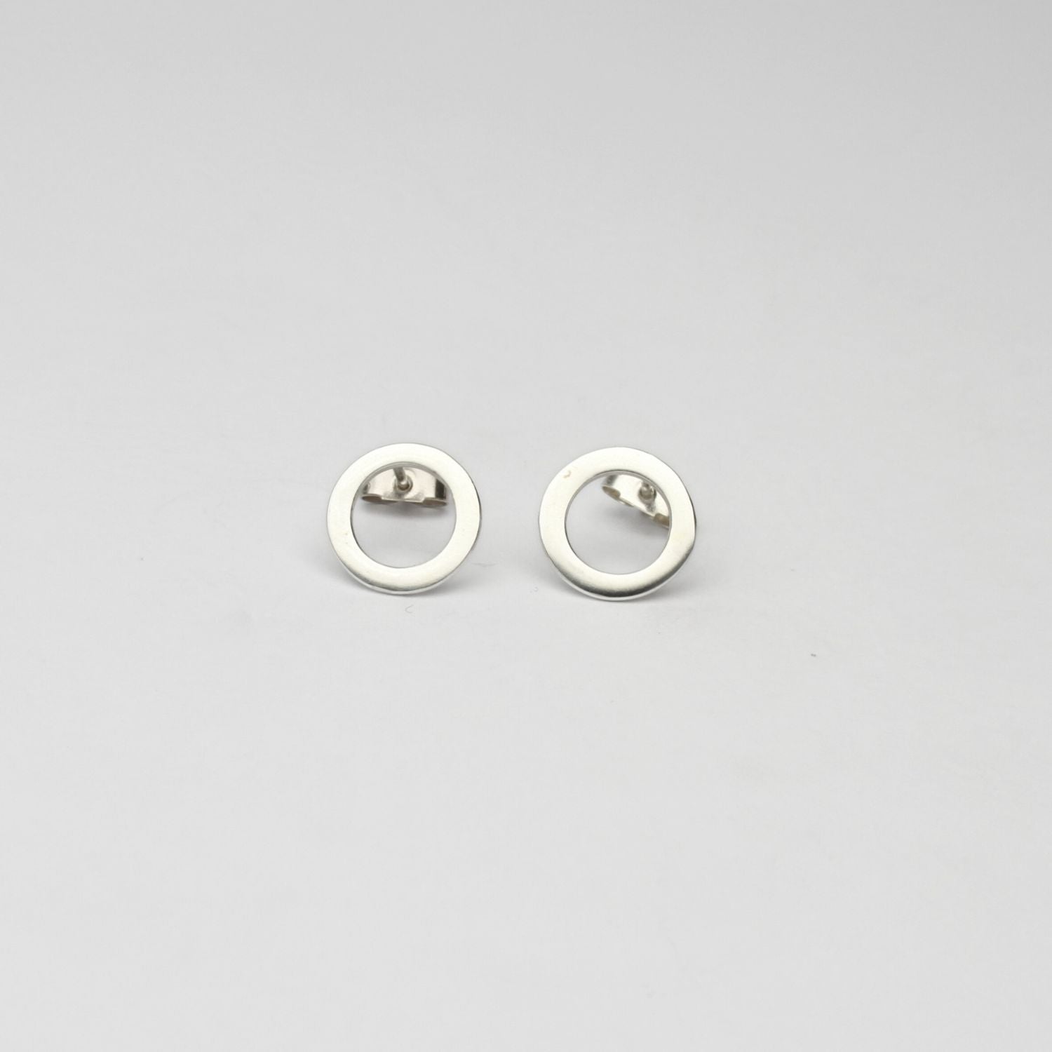 Small circle silver studs by Polished Grey