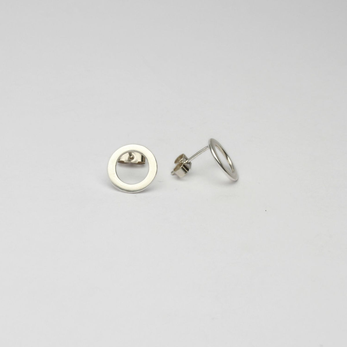 Small circle silver studs by Polished Grey