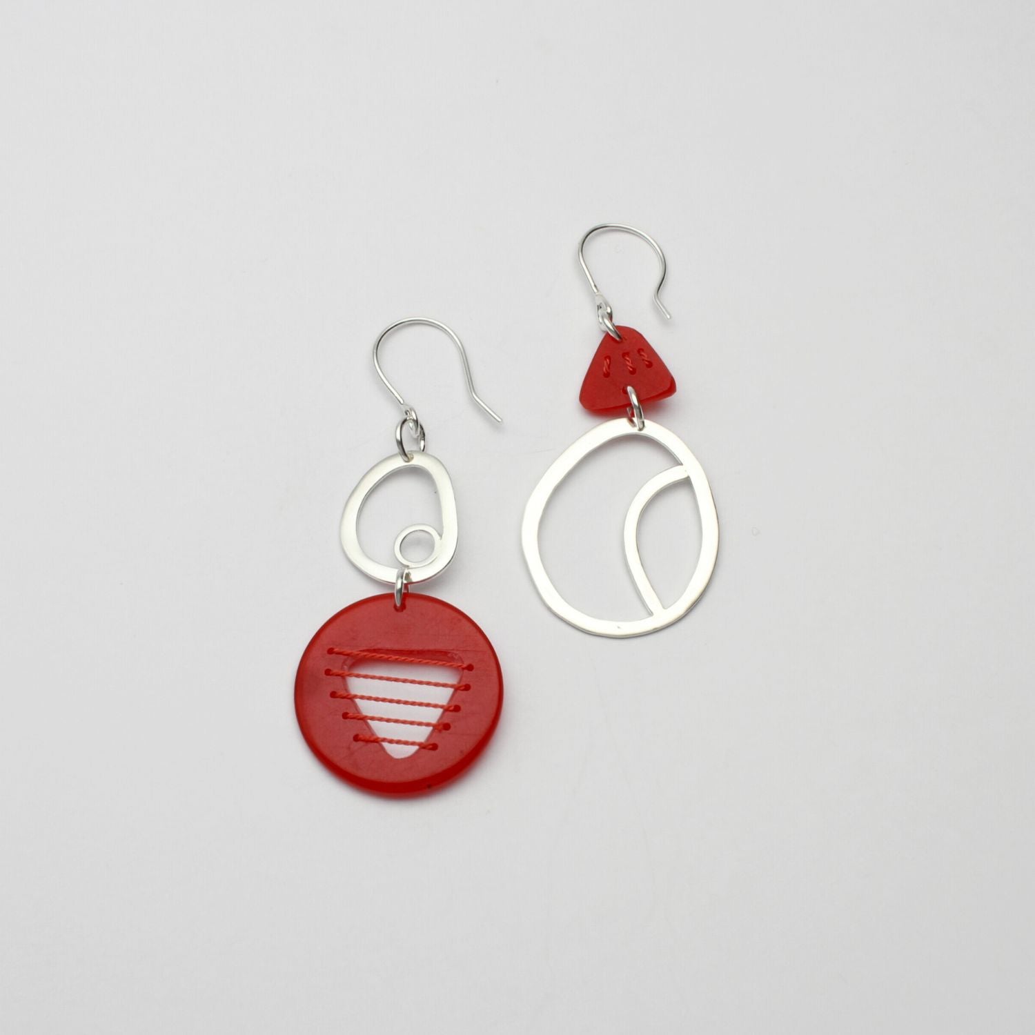 Red Tiddleywink stitched pebble silver earrings by Polished Grey