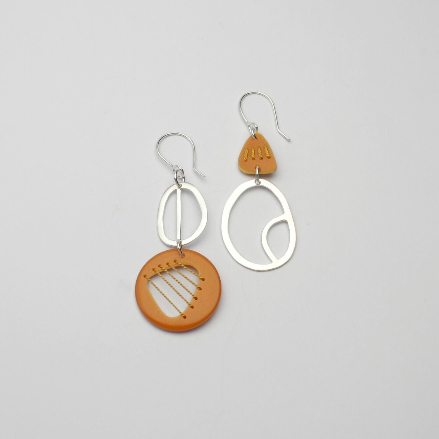 Yellow Tiddleywink stitched pebble silver earrings by Polished Grey