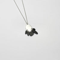 Black Tiddleywink pebble silver necklace by Polished Grey