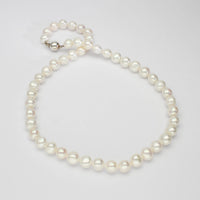 White pearl necklace with silver clasp