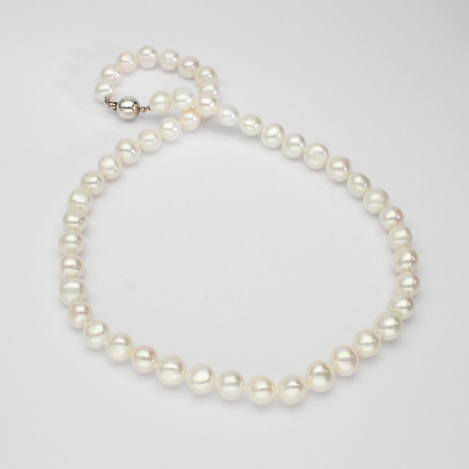 White pearl necklace with silver clasp